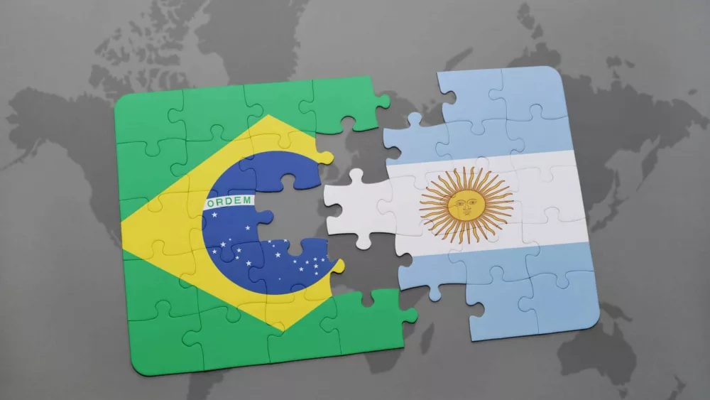 puzzle-with-the-national-flag-of-brazil-and-argentina-on-a-world-map-background