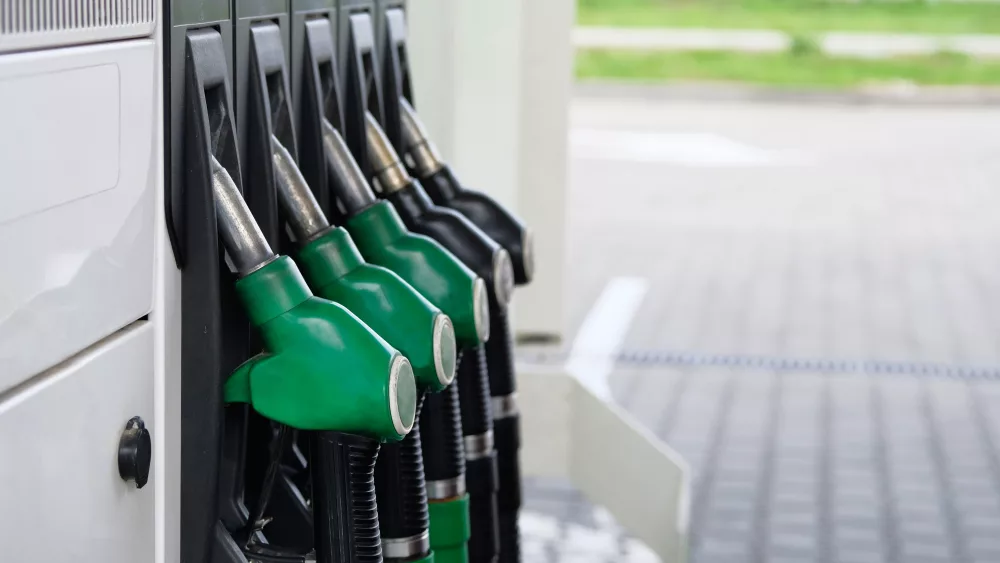 green-and-black-fuel-pistols-on-fuel-station-gas-station-and-petroling-concept-pumping-gas-at-gas-pump