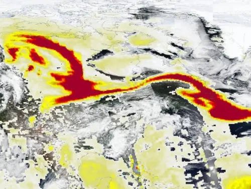 Satellite imagery showing a dense plume of wildfire smoke from Canada stretching across the northern United States and into the Atlantic Ocean.