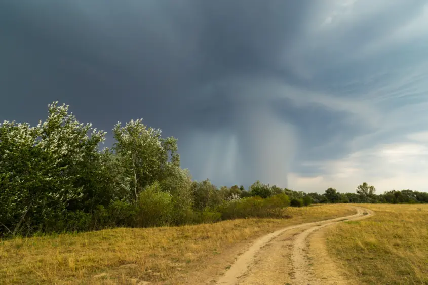 dramatic-storm-and-microburst-cloud-with-rain-over-country-road-in-rural-area