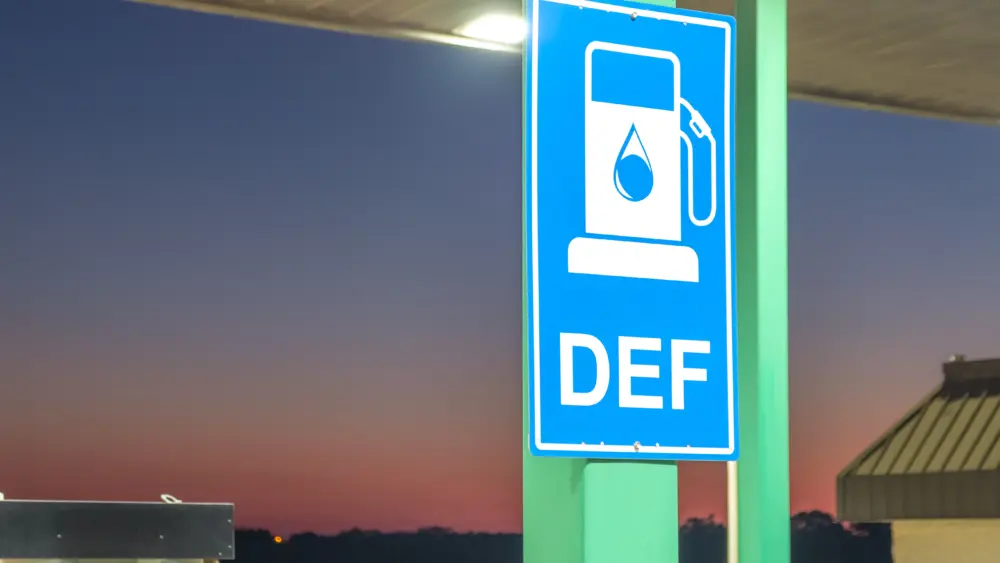 diesel-exhaust-fluid-or-def-sign-posted-in-a-truck-stop-next-to-fuel-pump