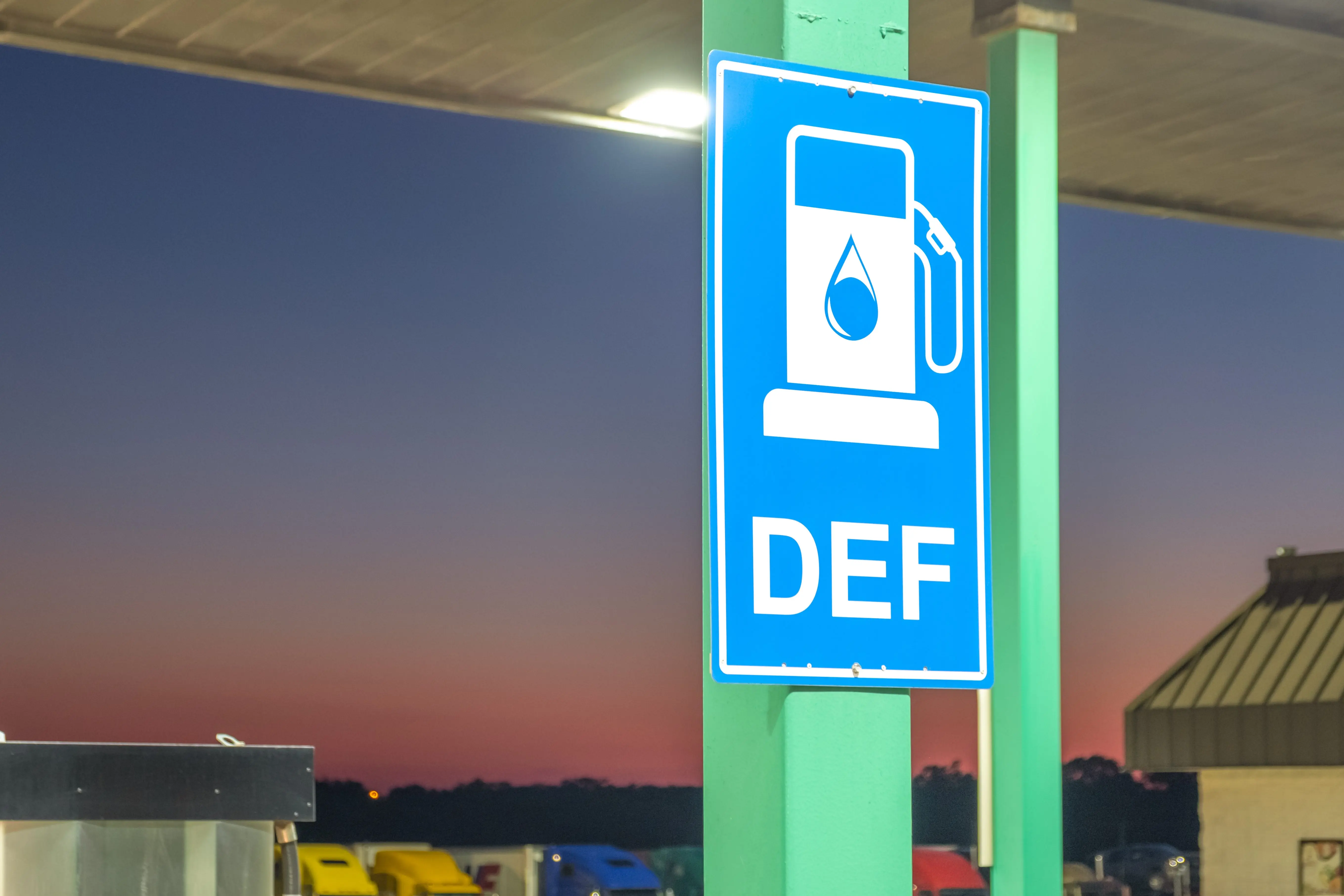 diesel-exhaust-fluid-or-def-sign-posted-in-a-truck-stop-next-to-fuel-pump