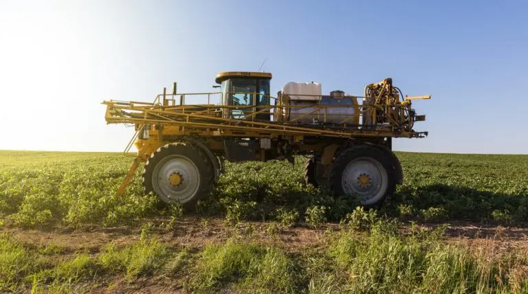 sprayer-sitting-in-a-field