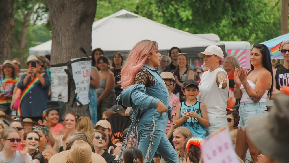 A performer walks past the audience during the inaugural Canyon County Pride event at Lakeview Park in Nampa in June 2024. (Courtesy of Canyon County Pride)