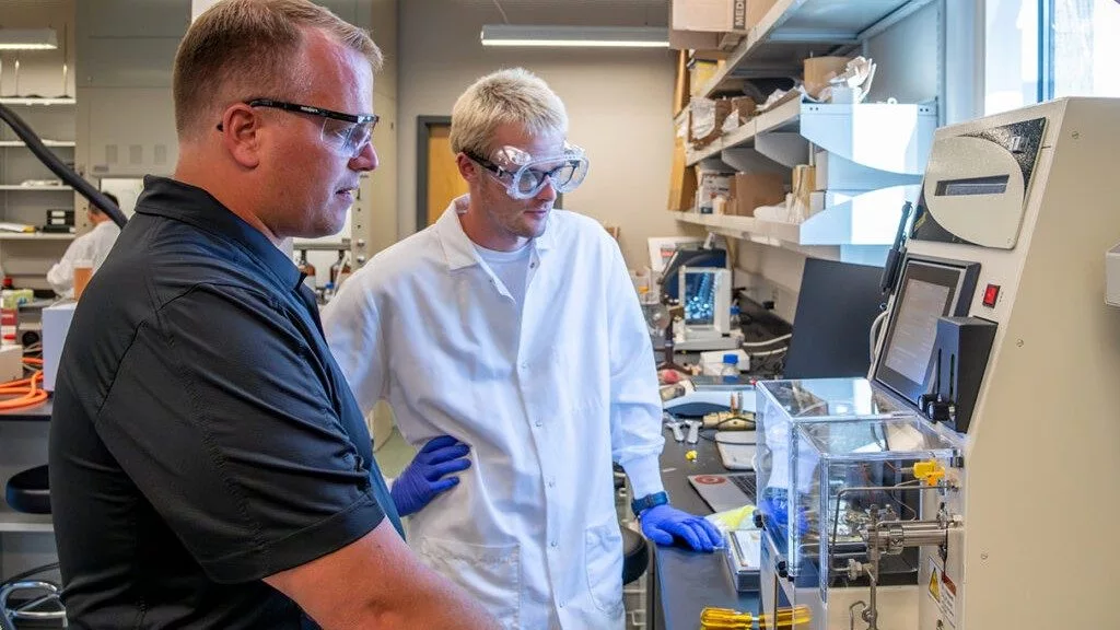 Joshua Heyne (left) and Conor Faulhaber, research assistant, in the BSEL lab. (Photo by WSU Tri‑Cities)