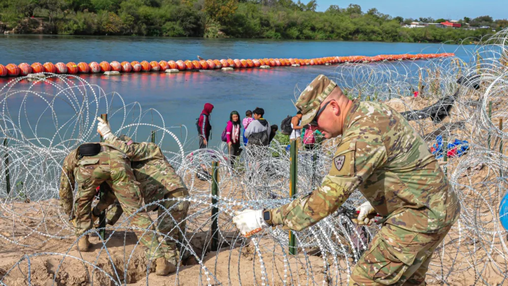 Concertina wire is installed along the banks of the Rio Grande River as part of "Operation Lone Star," Texas Gov. Greg Abbott's border security mission. Texas Gov. Greg Abbott via X