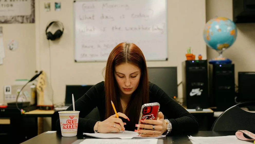 Emma Pearson, 18, works through a packet at Choice High School in Shelton on Wednesday, February 19, 2025. (Grant Hindsley for Cascade PBS)