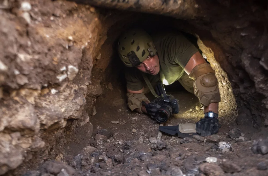 A Border Patrol agent searches a tunnel