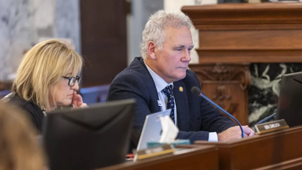 Idaho state Sen. Carl Bjerke, R-Coeur d’Alene, (right) listens to proceedings during the Joint Finance-Appropriations Committee meeting on Jan. 7, 2025, at the State Capitol Building in Boise. (Pat Sutphin for the Idaho Capital Sun)