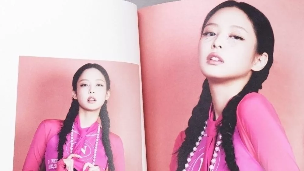 BlackPink BORN PINK 2nd Album photobook with Jennie on grey. Pink music CD in player.