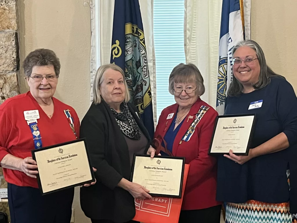 (from left to right) Darlene Larson, Jan Goodheart, AWC Literacy Program Chair Judi Wutzke, and Jenny Petty