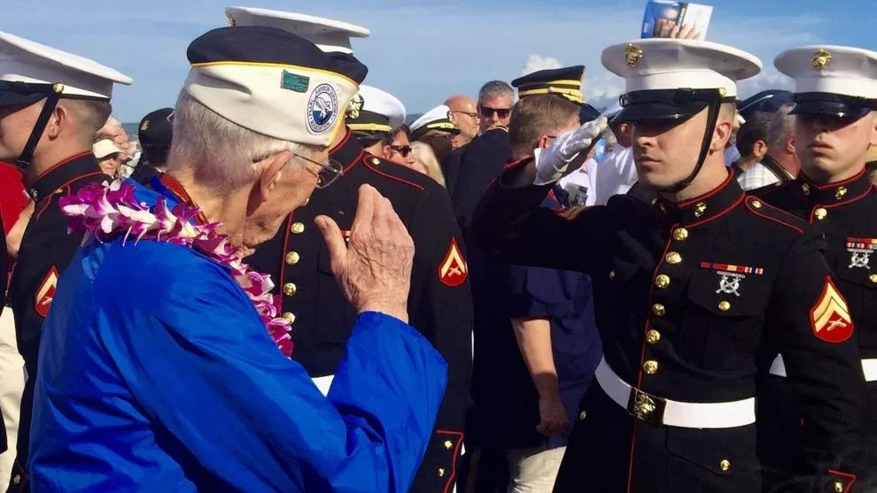 A young Marine salutes a Pearl Harbor survivor during the 75th anniversary of the attack on Pearl Harbor on Oahu, Hawaii. Sarah Roderick-Fitch | The Center Square