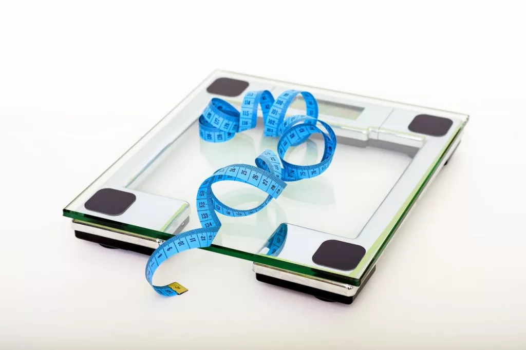 Photo by Pixabay: https://www.pexels.com/photo/blue-tape-measuring-on-clear-glass-square-weighing-scale-53404/