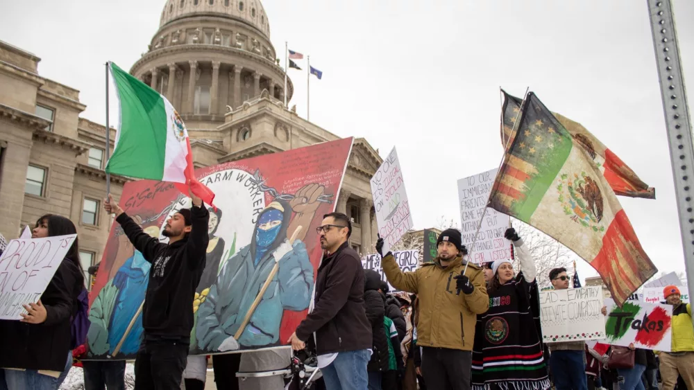 More than 100 people march outside of the Idaho State Capitol in Boise holding Mexican flags and signs protesting President Donald Trump’s immigration policies on February 7, 2025. (Mia Maldonado / Idaho Capital Sun)