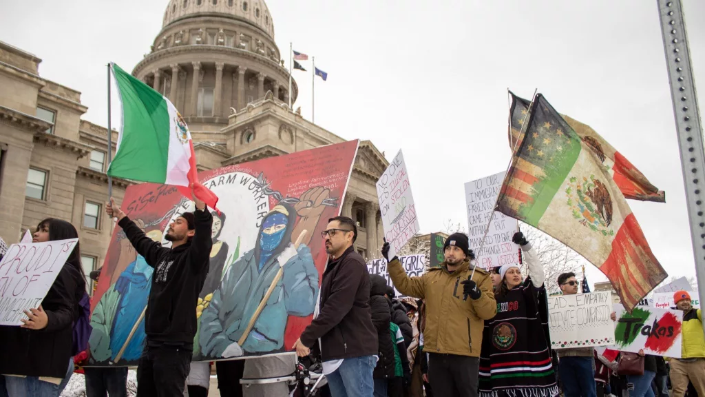More than 100 people march outside of the Idaho State Capitol in Boise holding Mexican flags and signs protesting President Donald Trump’s immigration policies on February 7, 2025. (Mia Maldonado / Idaho Capital Sun)