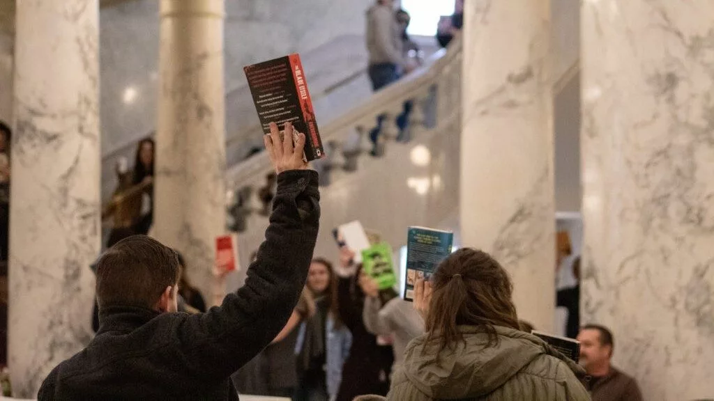 As Republican lawmakers across the U.S. have implemented laws allowing individuals to request the removal of books they believe are harmful to minors — such as in neighboring Idaho as shown in the photo above — Democratic Oregon lawmakers are taking a different approach through Senate Bill 1098. (Mia Maldonado/Idaho Capital Sun)