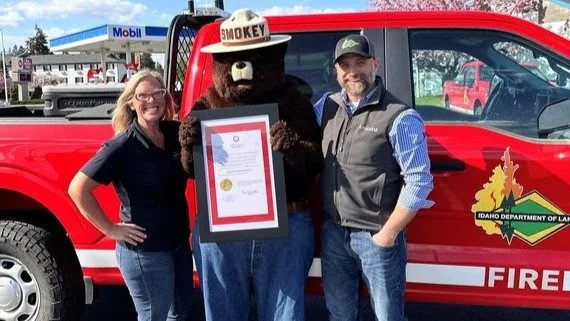 Left to right, IDL Fire Prevention Officer Jennifer Russell, Smokey Bear, IDL Director Dustin Miller