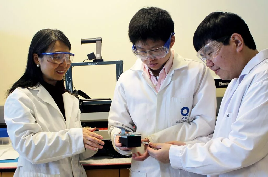 L-R Professor Annie Du, postdoctoral researcher Xinyi Li, and research scientist Zhansen Yang developed a paper sensor along with a smartphone-based reader that can rapidly provide information on a person’s personal smoke exposure during wildfire season. Li and Yang are co-first authors on the work.