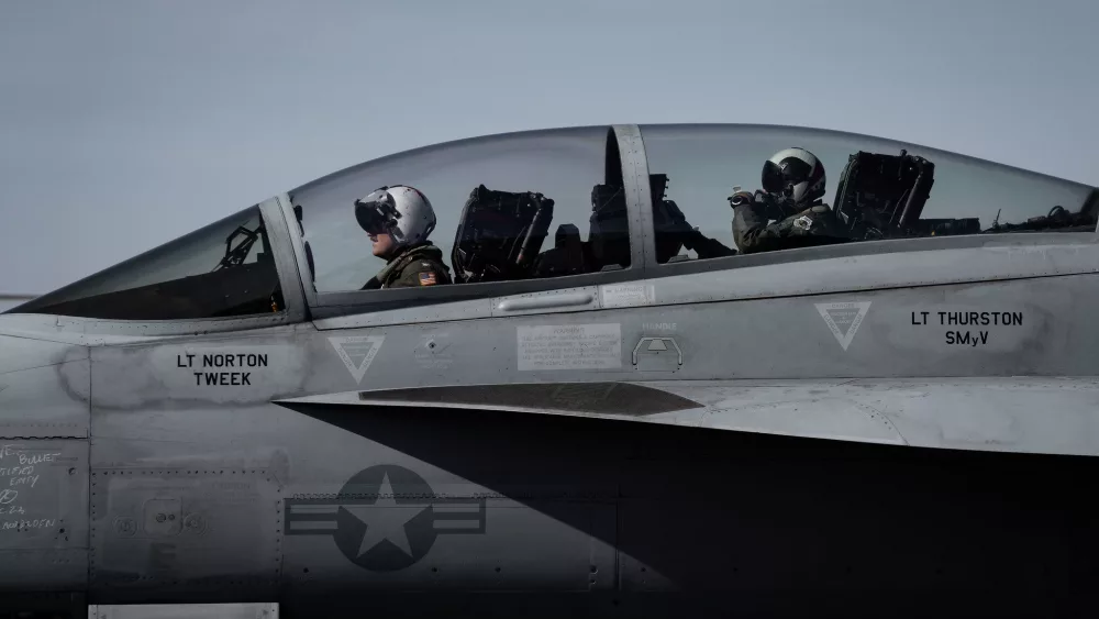U.S. Air Force Gen. CQ Brown, Jr., Chairman of the Joint Chiefs of Staff, rear, and U.S. Navy Captain Chad Heirigs, Deputy Commander of Carrier Air Wing (CVW) 11, prepare to exit an F/A-18F Super Hornet after landing on Naval Air Staion North Island, Dec. 3, 2023. Brown and Heirigs flew from the Nimitz-class aircraft carrier USS Theodore Roosevelt. (DOD Photo by Chief Mass Communication Specialist James Mullen)