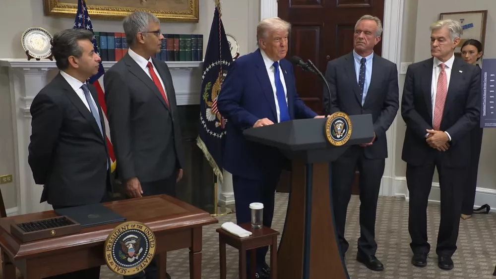 President Donald Trump addresses reporters as he prepares to sign the "Delivering Most-favored-nation Prescription Drug Pricing to American Patients" executive order on Monday, May 12, 2025. The White House | YouTube