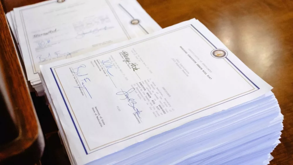 Gov. Bob Ferguson’s signature on the the 1,367 page document outlining the state’s 2025 operating budget. (Photo by Jacquelyn Jimenez Romero/Washington State Standard)