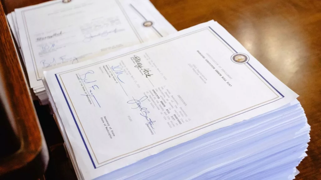 Gov. Bob Ferguson’s signature on the the 1,367 page document outlining the state’s 2025 operating budget. (Photo by Jacquelyn Jimenez Romero/Washington State Standard)