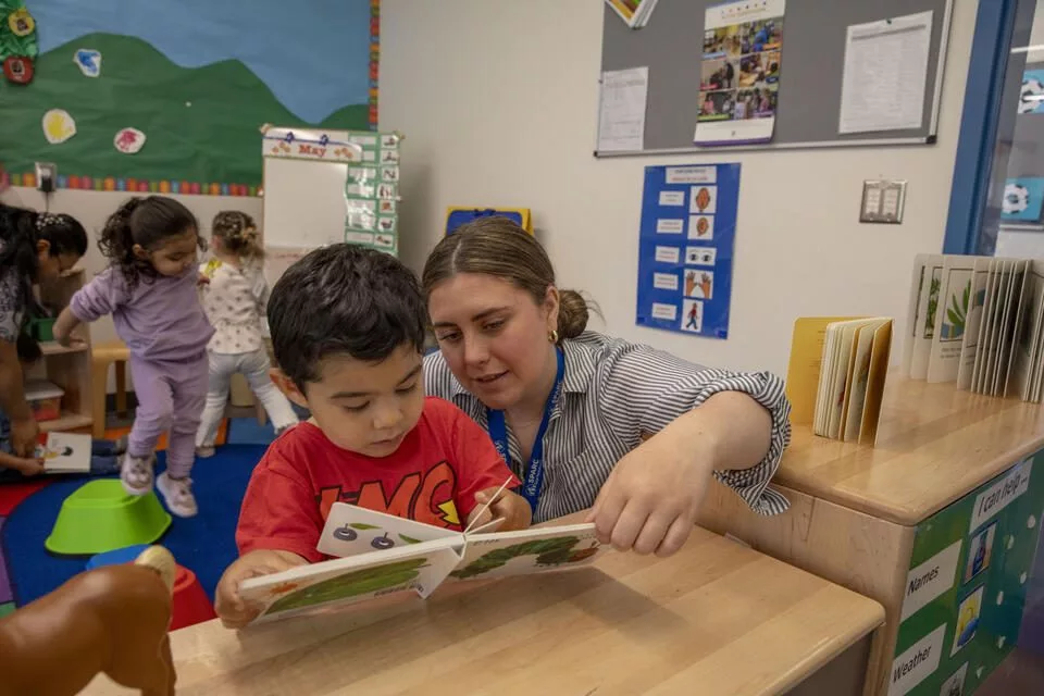 Anneliese Hellner, speeach language pathologist, works with Eliantte Ortiz Corona, 2, right, during playtime at the Sue Krienan Early Learning Center, Skagit/Island Early Head Start Program associated with Skagit Valley College.(Ting-Li Wang for Cascade PBS)