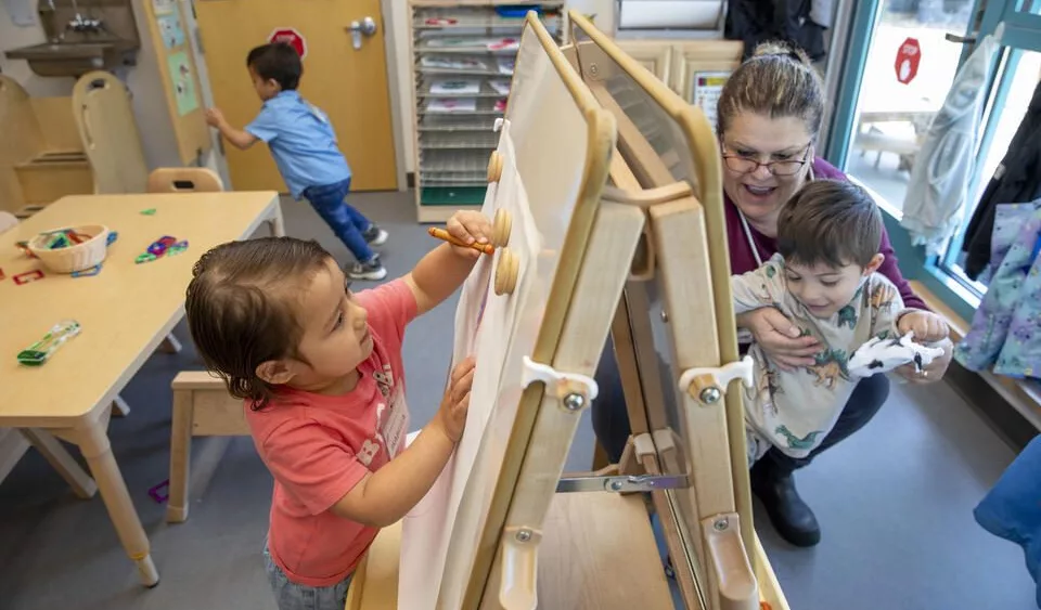 Washington’s Head Start Association is suing the Trump administration over funding cuts that have led to confusion, some temporary closures and layoffs of administrative staff. Meanwhile, the state is cutting funds to state early learning programs. Providers in the programs, such as the Skagit/Island Head Start at Skagit Valley College, which serves the most-vulnerable families in Washington, are caught in the middle and anxious about what’s next. Isabella Jimenez, 3, left, and teacher Maria Saulness with Duane Kusler, during playtime at the Sue Krienan Early Learning Center, Skagit/Island Early Head Start Program, May 21, 2025. (Ting-Li Wang for Cascade PBS)