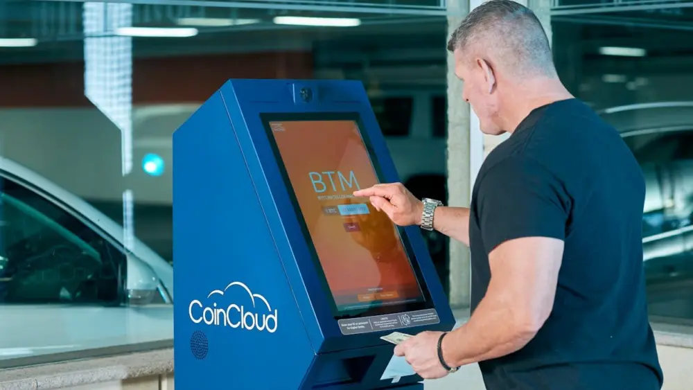 Photo by Elise: https://www.pexels.com/photo/a-man-in-black-shirt-using-atm-6132773/