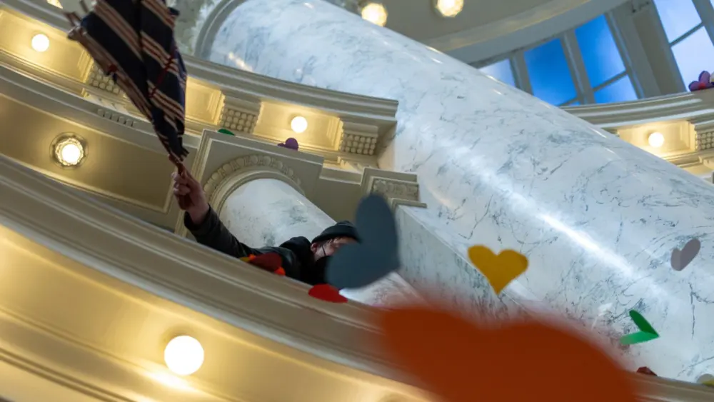 Protestors on April 2, 2024, dropped 48,000 handmade hearts — meant to represent LGBTQ Idahoans, in protest of anti-LGBTQ legislation — down the rotunda of the Idaho State Capitol Building. (Kyle Pfannenstiel/Idaho Capital Sun)