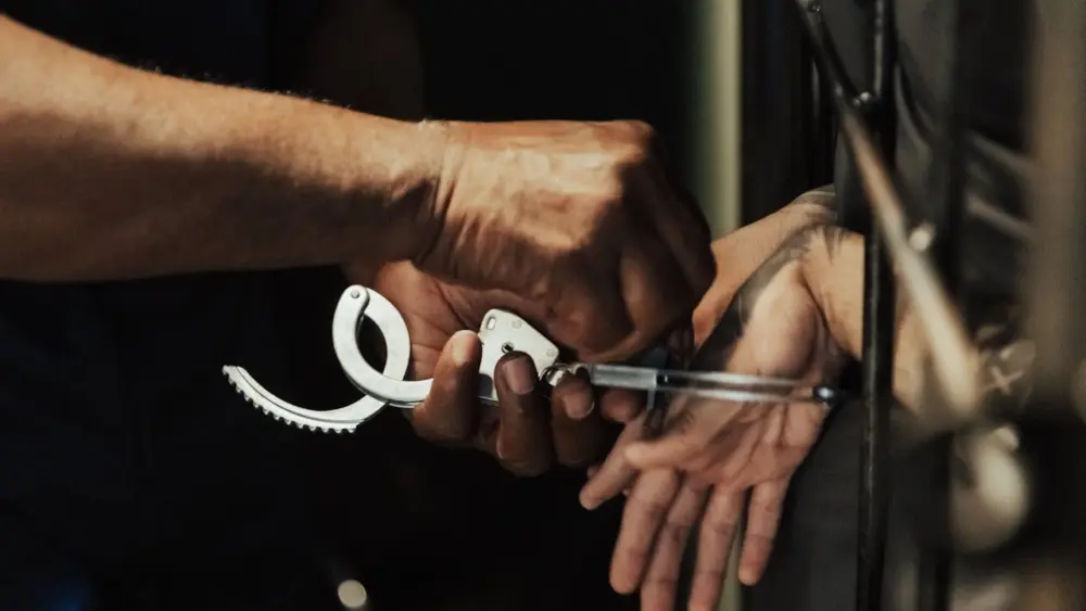 Photo by Ron Lach : https://www.pexels.com/photo/handcuffs-being-taken-off-10475172/