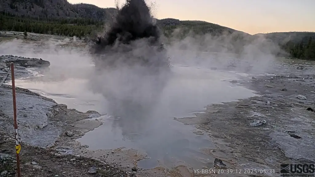 This frame capture of a video from a webcam shows a small eruption emanating from Black Diamond Pool in Biscuit Basin, a subbasin of Upper Geyser Basin in Yellowstone National Park, on May 31, 2025. This was the site of a hydrothermal explosion on July 23, 2024. (Provided by the Yellowstone Volcano Observatory)