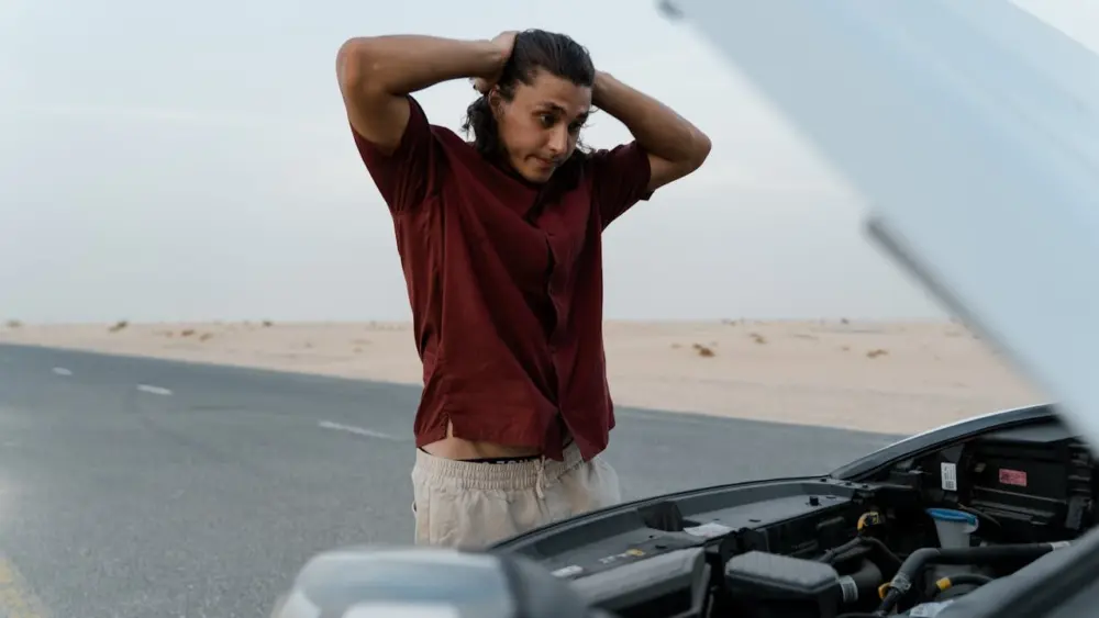 Photo by MART PRODUCTION: https://www.pexels.com/photo/an-upset-man-looking-at-his-broken-car-8869260/
