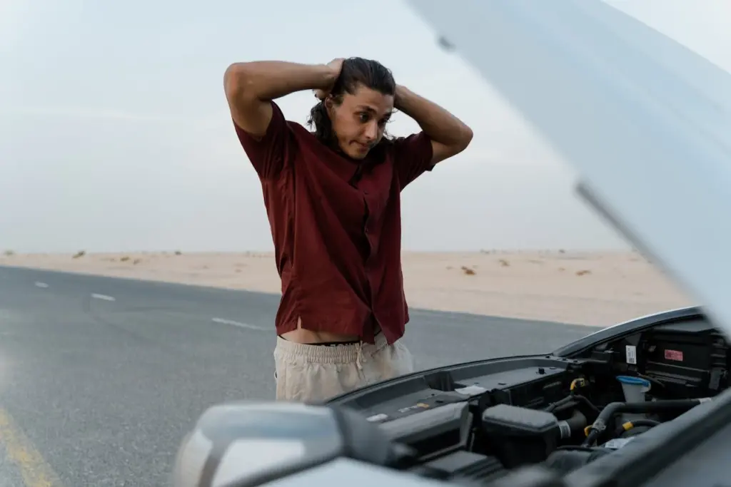 Photo by MART PRODUCTION: https://www.pexels.com/photo/an-upset-man-looking-at-his-broken-car-8869260/