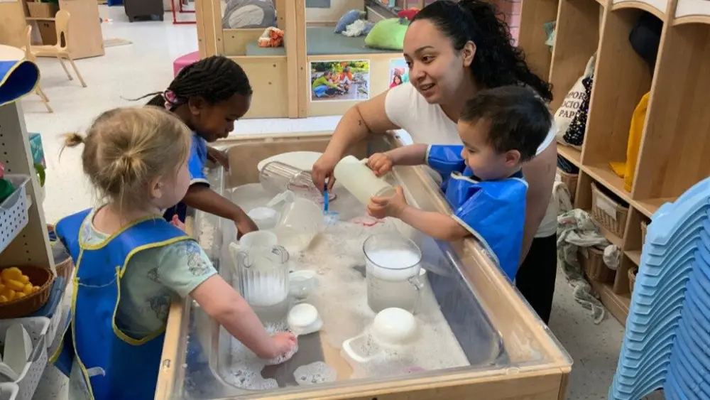 Nele Escobar works with children at the WSU Children’s Center.
