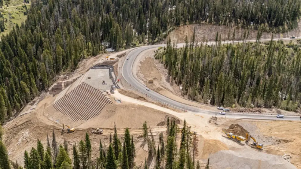 Crews are nearly finished rebuilding the section of highway that collapsed last year on Teton Pass. To guard against future landslides, the project has installed drainage, stitched the base together with micropiles and used lighter-weight material to complete the “Big Fill.” (Photo courtesy of the Wyoming Department of Transportation)