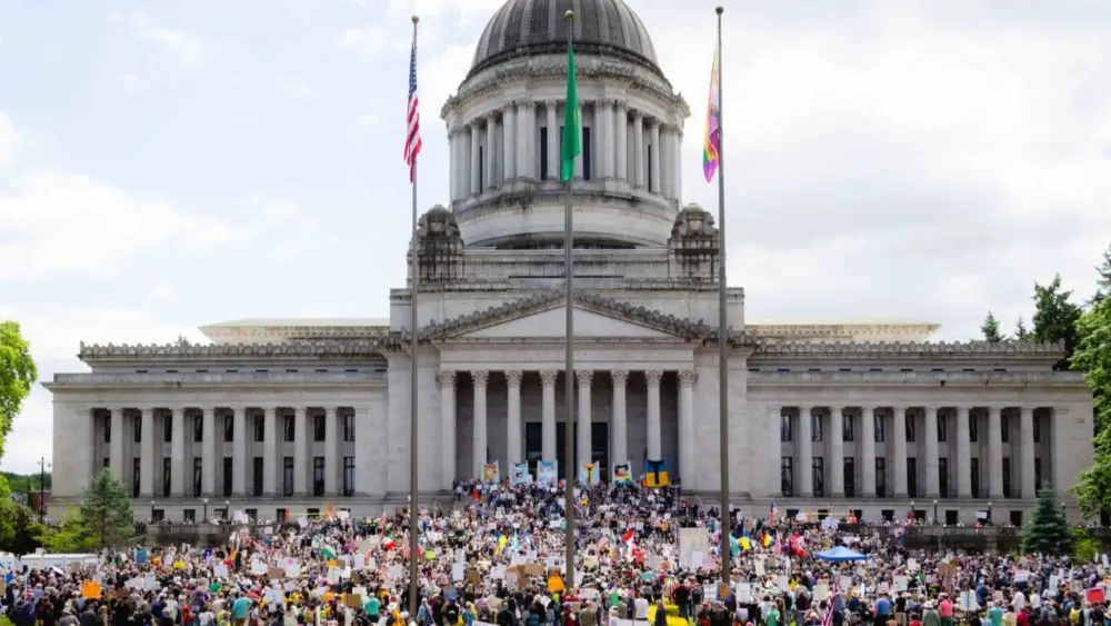 Thousands of people gathered in Olympia for the “No Kings” rally on Saturday June 14, 2025 at the state Capitol. (Photo by Jacquelyn Jimenez Romero/Washington State Standard)