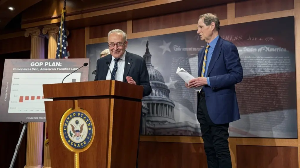 U.S. Senate Minority Leader Chuck Schumer, D-N.Y., speaks during a press conference inside the Capitol building on Wednesday, June 18, 2025. Oregon Democratic Sen. Ron Wyden is at right. (Photo by Jennifer Shutt/States Newsroom)