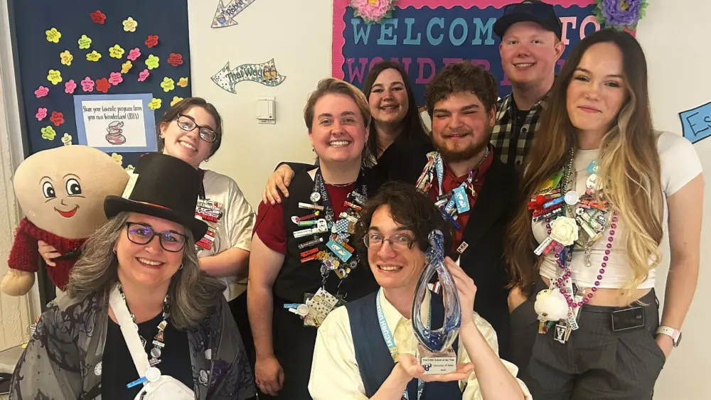 Members of U of I's RHA pose for a photo with the NACURH School of the Year award. - University of Idaho