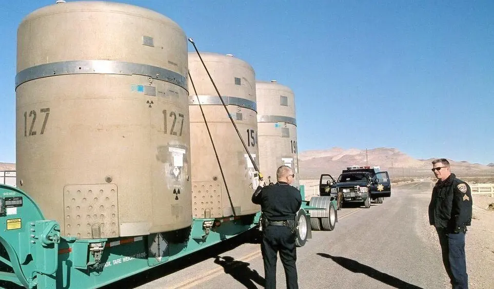Nevada and California Highway Patrol Officers conduct radiological surveys and mechanical inspections on the first Nevada Test Site transuranic waste shipment at the Area 5 Radioactive Waste Management Complex located on the Nevada Test Site. The shipment is destined for the Waste Isolation Pilot Plant located near Carlsbad, New Mexico.