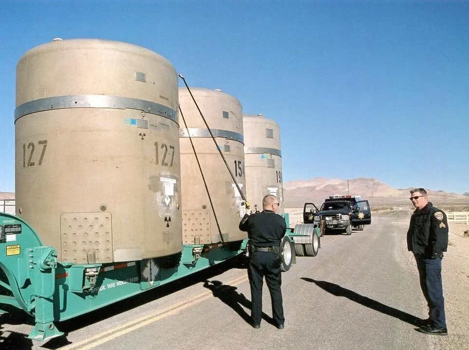 Nevada and California Highway Patrol Officers conduct radiological surveys and mechanical inspections on the first Nevada Test Site transuranic waste shipment at the Area 5 Radioactive Waste Management Complex located on the Nevada Test Site. The shipment is destined for the Waste Isolation Pilot Plant located near Carlsbad, New Mexico.