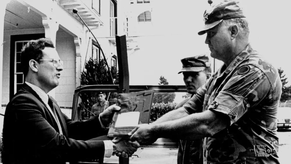 Norman Schwarzkopf, then a lieutenant general, transfers his command jeep to Alan Archambault, director of the Lewis Army Museum, in 1987. (Photo courtesy of Alan Archambault)