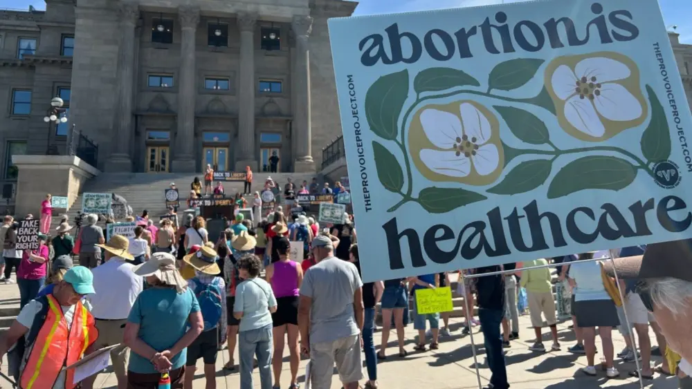 A few hundred people attended a rally in front of the Idaho State Capitol on Saturday to support the start of signature gathering for an abortion rights ballot initiative. (Kyle Pfannenstiel/Idaho Capital Sun)