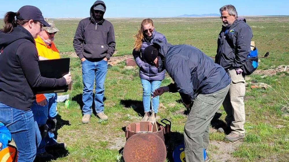 A conservation district employee measures groundwater at a monitoring well in Lincoln County, as part of a training and monitoring session in 2021 led by the Department of Ecology. Sasha McLarty, an assistant professor in the Department of Civil and Environmental Engineering at WSU, has published new research on the region’s aquifer system based on data from such wells. (Photo by Sasha McClarty)