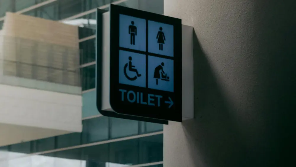 Photo by Ondosan Sinaga: https://www.pexels.com/photo/signboard-of-public-toilet-placed-on-wall-7638123/