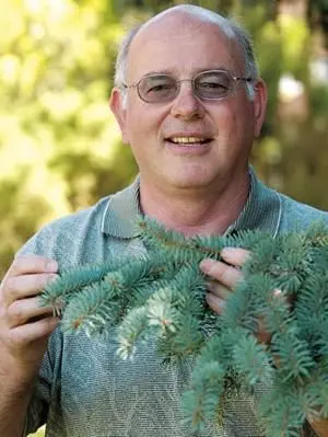 Gary Chastagner holding part of a branch to an evergreen tree.Gary Chastagner, Emeritus Professor of Plant Pathology, has aided growers and appreciators of ornamental crops for over 40 years through his WSU research and Extension program.