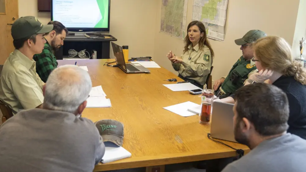 Monument Ranger Rebecca Hoffman (top right) and her staff at a meeting on Sept. 23, 2019 at Mount St. Helens National Volcanic Monument in the Gifford Pinchot National Forest in Washington. The forest is part of the U.S. Forest Service Region 6, who will lose its regional headquarters under a new plan from the U.S. Department of Agriculture. (Photo courtesy of USDA /Cecilio Ricardo)