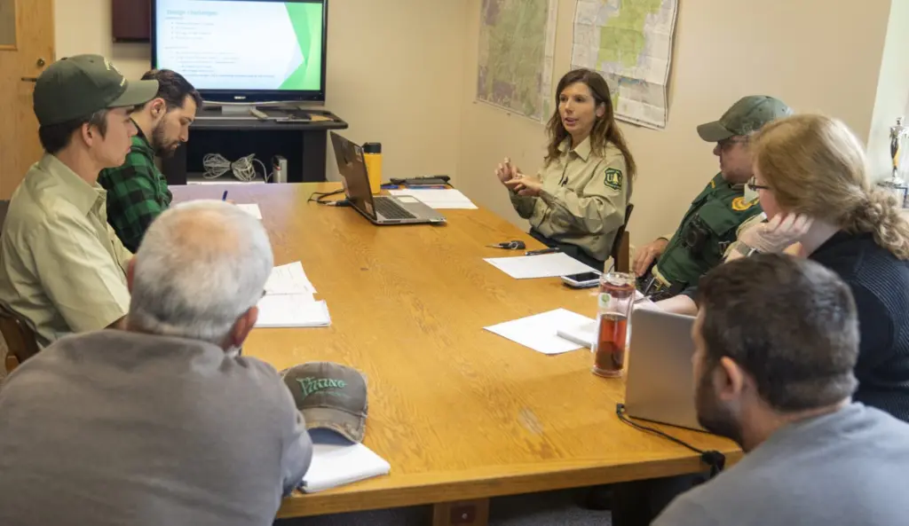 Monument Ranger Rebecca Hoffman (top right) and her staff at a meeting on Sept. 23, 2019 at Mount St. Helens National Volcanic Monument in the Gifford Pinchot National Forest in Washington. The forest is part of the U.S. Forest Service Region 6, who will lose its regional headquarters under a new plan from the U.S. Department of Agriculture. (Photo courtesy of USDA /Cecilio Ricardo)