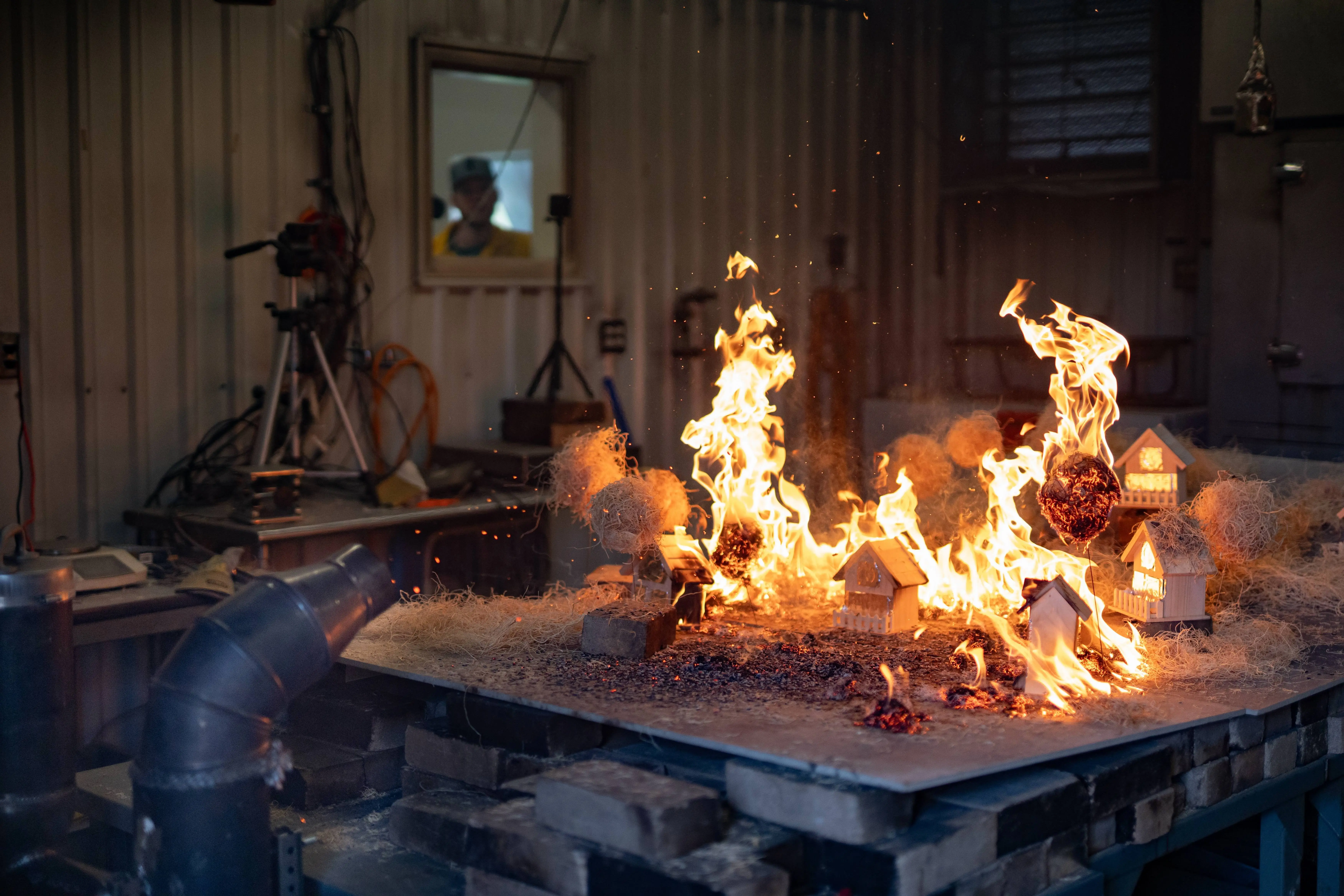 An experiment is conducted on the College of Natural Resources Ember Generator for Forest Fire Simulator. The Ember Generator is used to simulate wildfire conditions and allow for the study of ember propagated wildfires.