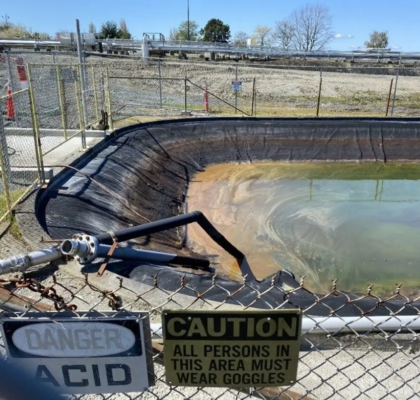 A portion of a 150,000-gallon pond at the Marathon Anacortes refinery, where Washington state officials say Tesoro mishandled acid waste. (Photo courtesy of Washington State Department of Ecology)